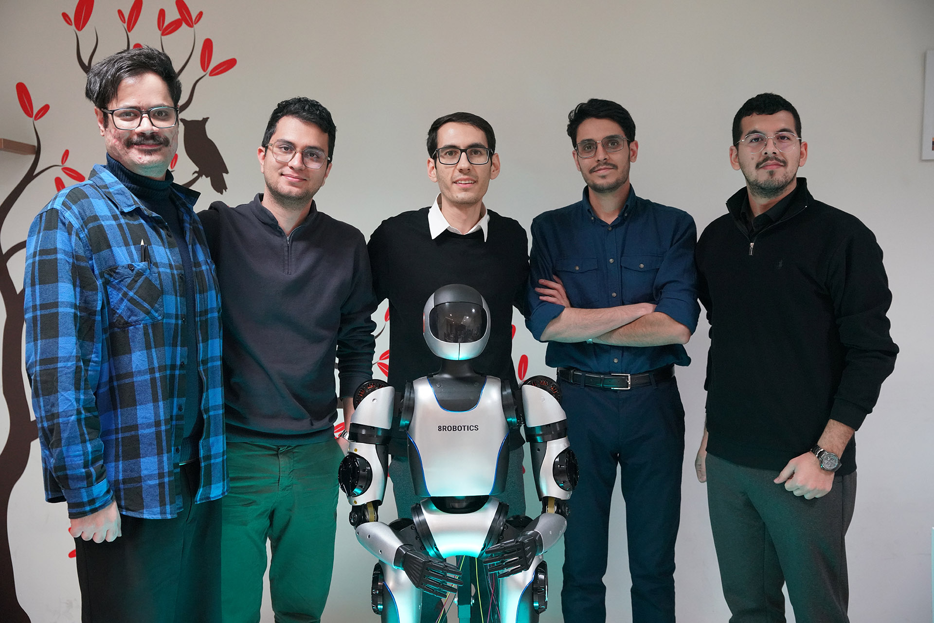 The 8Robotics team with the ILIA humanoid robot